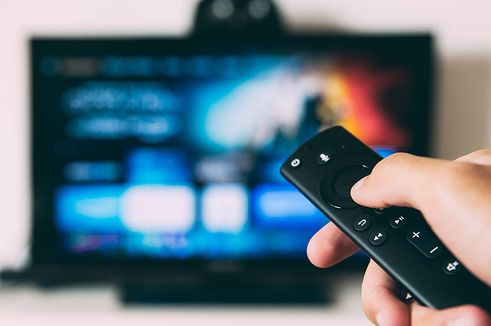 person using a remote control